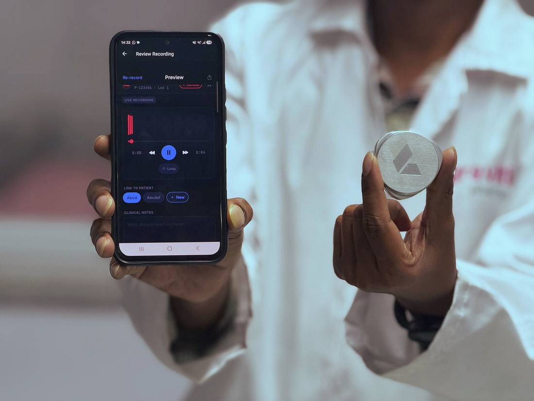 A clinician holding the Plazma auscultation device beside a phone showing a live recording.